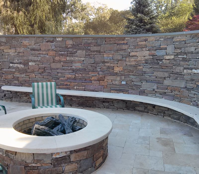 caramel travertine firepit caps and bench seating