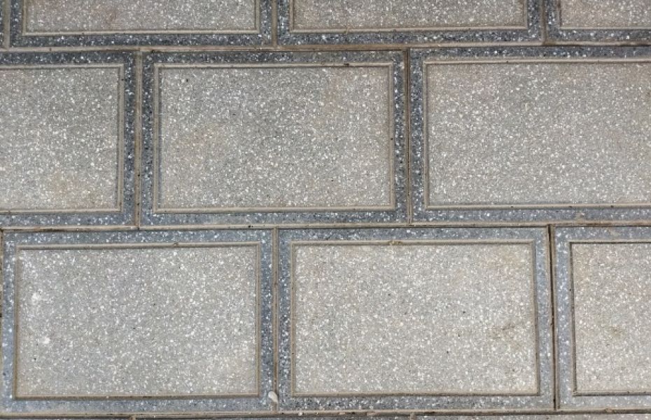 Terrazzo which is gray rectangles sandblasted with polished borders